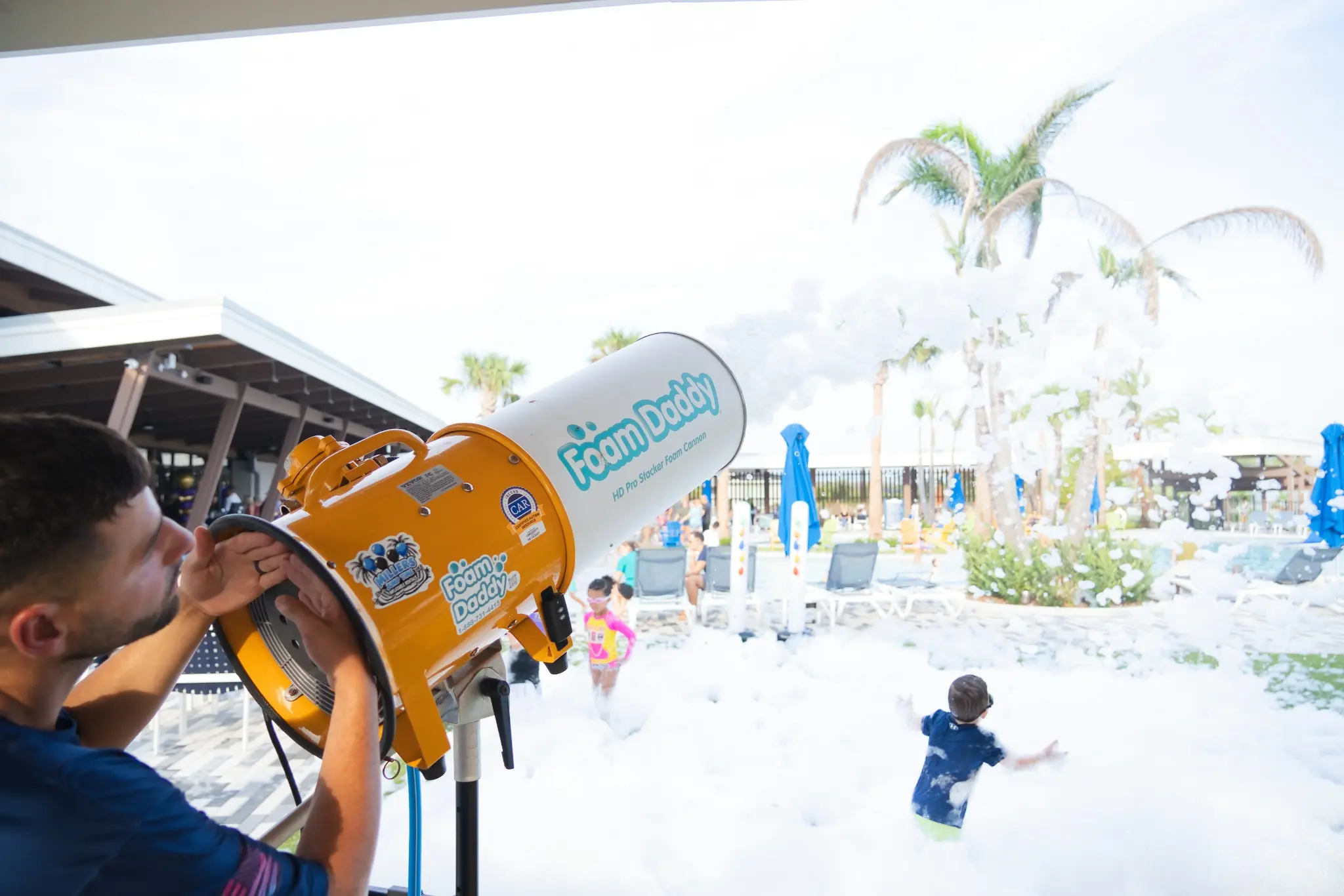 FoamHype operator aiming a professional foam cannon at an event
